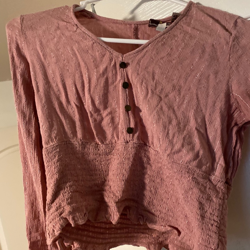 A pink sparkling blouse.